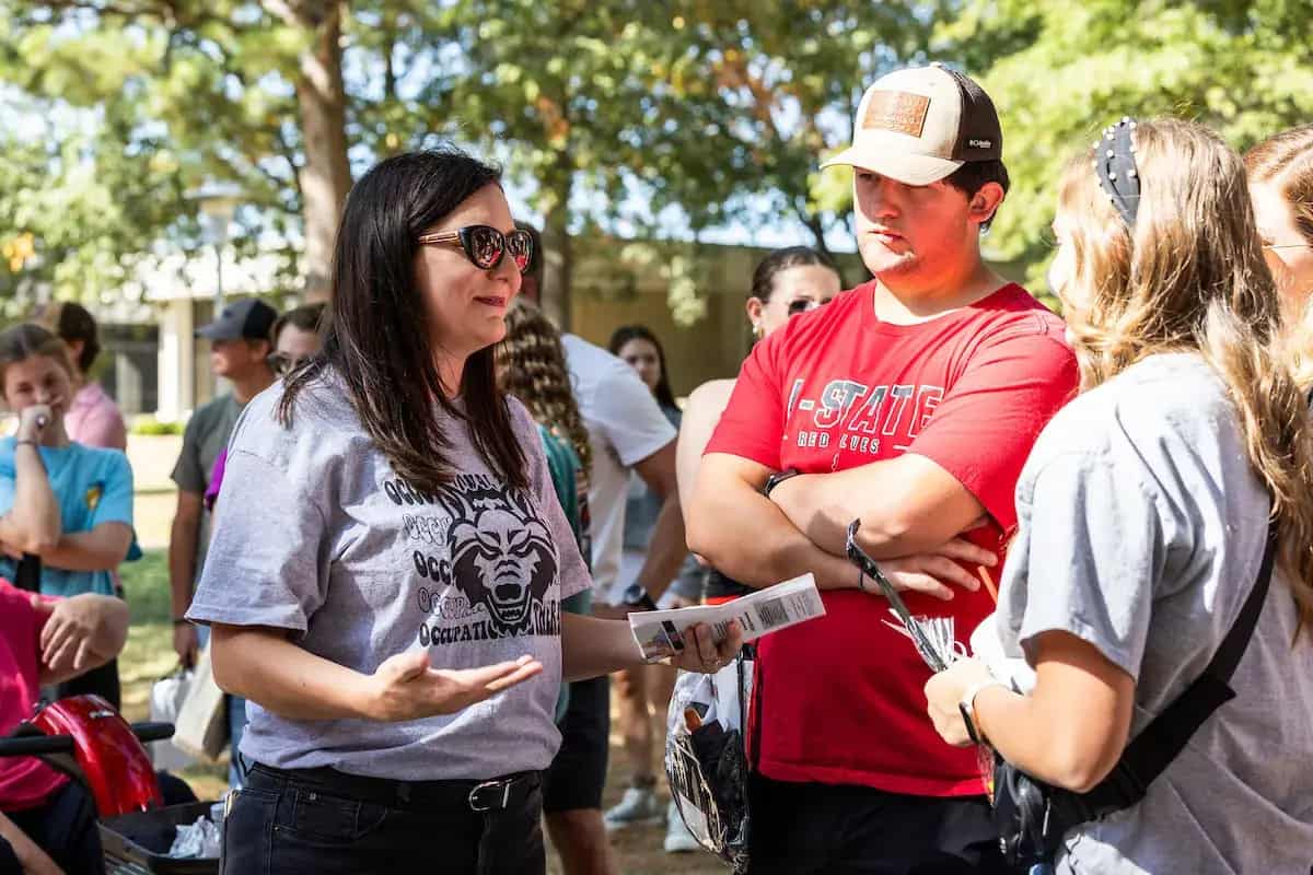 Advisor talking with students
