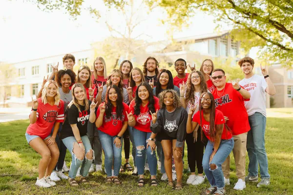 A-State students making the Red Wolves Up sign